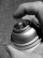 Finger on Spray Can